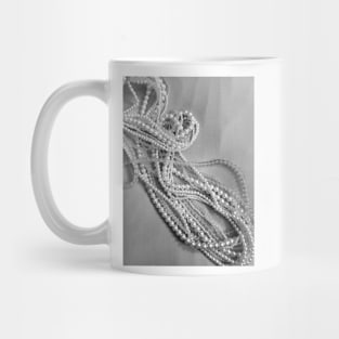 Pearls and beads on a black and white background Mug